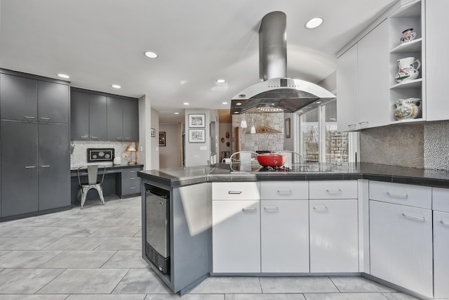 80 Norton Rd, Easton, CT 06612 - kitchen with island range hood, a peninsula, open shelves, decorative backsplash, and recessed lighting