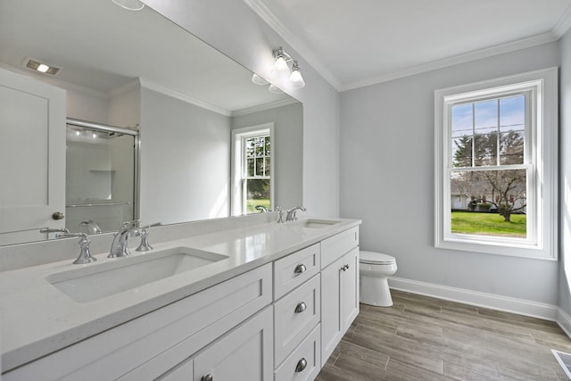 01 Sunrise Rd, Danbury, CT 06811 - bathroom featuring double vanity, a shower with shower door, wood finished floors, and crown molding