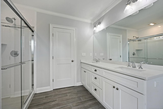 01 Sunrise Rd, Danbury, CT 06811 - bathroom with a stall shower, double vanity, wood finished floors, and ornamental molding