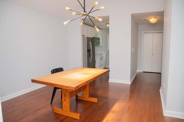 234 Greens Farm Rd Unit 234, Branford, CT 06405 - dining space with a chandelier and dark wood-style floors
