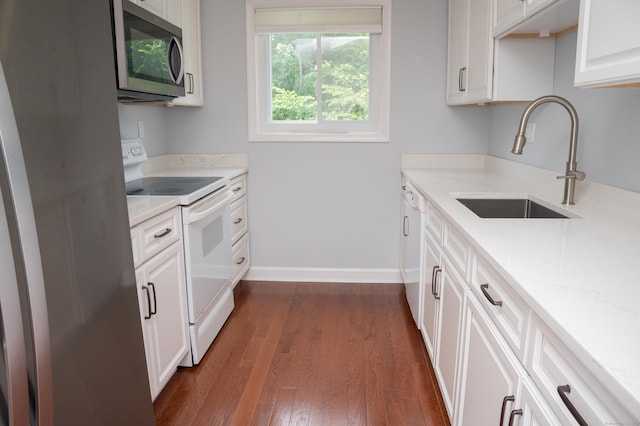 234 Greens Farm Rd Unit 234, Branford, CT 06405 - kitchen with white appliances, dark wood-type flooring, white cabinets, and light stone counters
