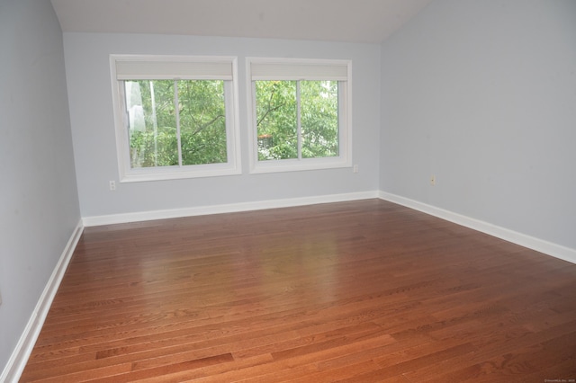 234 Greens Farm Rd Unit 234, Branford, CT 06405 - empty room featuring wood finished floors and lofted ceiling