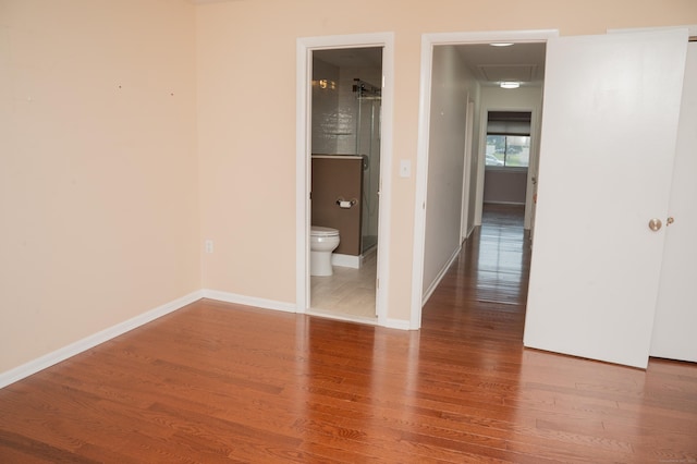 234 Greens Farm Rd Unit 234, Branford, CT 06405 - unfurnished bedroom with wood finished floors, connected bathroom, and attic access