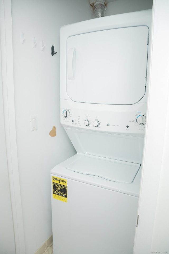 234 Greens Farm Rd Unit 234, Branford, CT 06405 - laundry room featuring stacked washer / dryer
