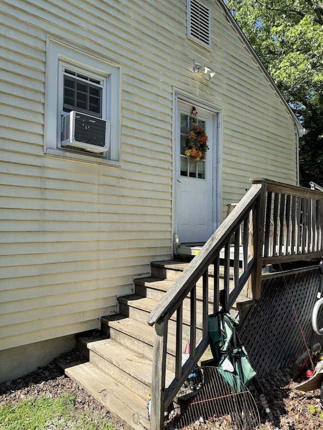 74 Pine Rd, East Haddam, CT 06423 - view of exterior entry with a wooden deck and cooling unit