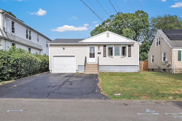 474 Franklin Ave, Stratford, CT 06614 - view of front of home with a front lawn, asphalt driveway, an attached garage, and entry steps