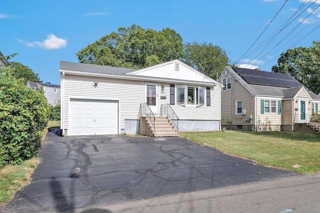 474 Franklin Ave, Stratford, CT 06614 - view of front of property with a front yard, asphalt driveway, and an attached garage