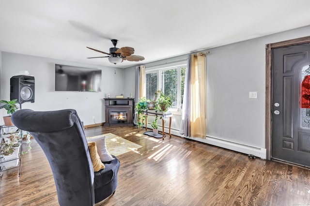 474 Franklin Ave, Stratford, CT 06614 - living area featuring ceiling fan, wood finished floors, baseboard heating, and a glass covered fireplace