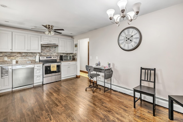 474 Franklin Ave, Stratford, CT 06614 - kitchen featuring stainless steel appliances, under cabinet range hood, decorative backsplash, dark wood-style floors, and ceiling fan