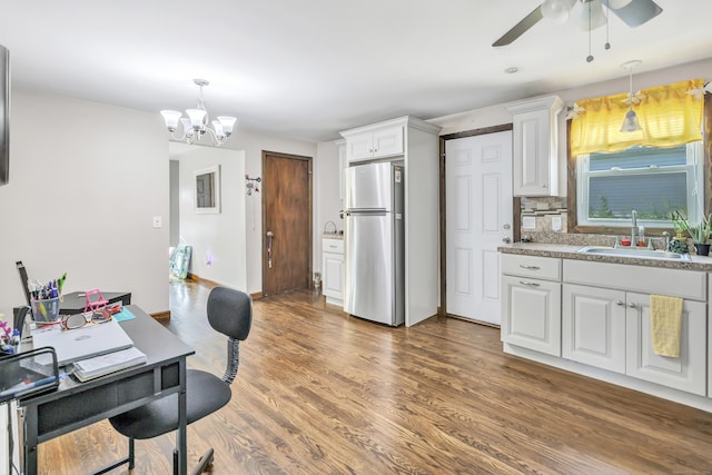 474 Franklin Ave, Stratford, CT 06614 - kitchen featuring freestanding refrigerator, a ceiling fan, white cabinetry, a chandelier, and wood finished floors