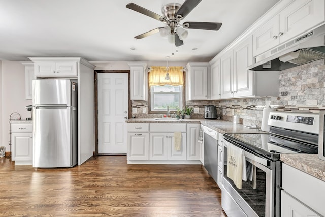 474 Franklin Ave, Stratford, CT 06614 - kitchen with appliances with stainless steel finishes, under cabinet range hood, a ceiling fan, and white cabinetry