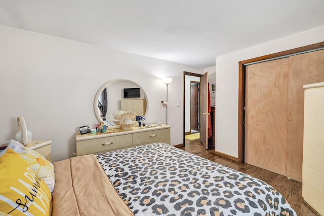474 Franklin Ave, Stratford, CT 06614 - bedroom with dark wood-type flooring and baseboards