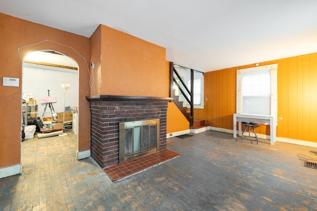 370 Waterville St, Waterbury, CT 06710 - unfurnished living room with hardwood / wood-style flooring, a fireplace, and stairs
