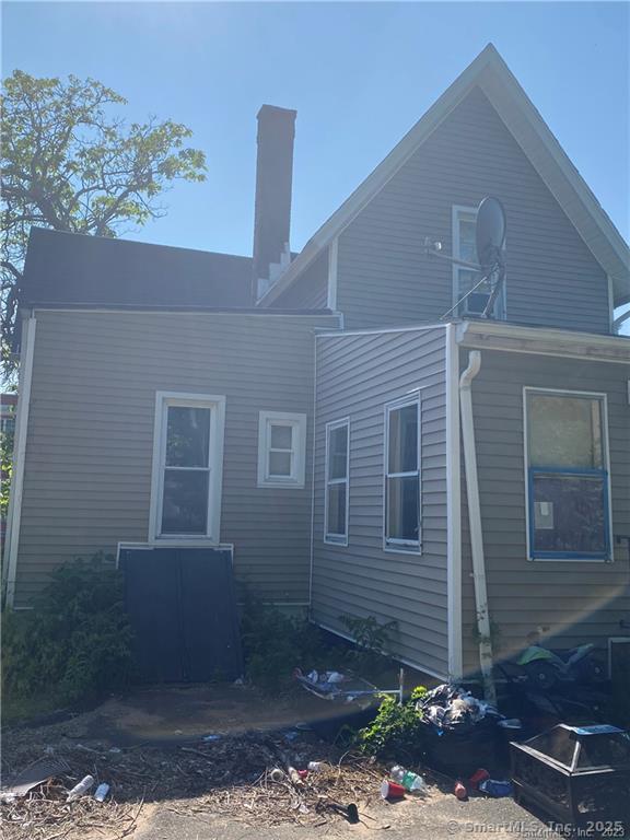 257 Blake St, New Haven, CT 06515 - back of house featuring a chimney
