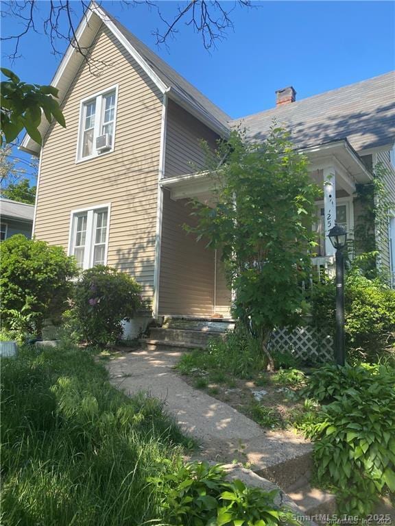257 Blake St, New Haven, CT 06515 - view of home's exterior featuring a chimney