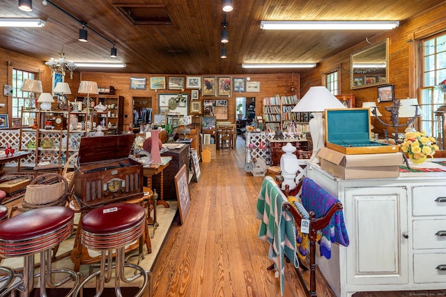 696 Kent Rd, New Milford, CT 06755 - misc room featuring wooden walls, light wood finished floors, a chandelier, and wood ceiling