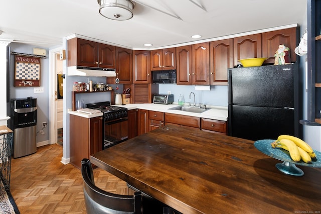 696 Kent Rd, New Milford, CT 06755 - kitchen with black appliances, recessed lighting, and under cabinet range hood