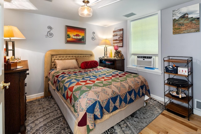 696 Kent Rd, New Milford, CT 06755 - bedroom featuring cooling unit and wood finished floors