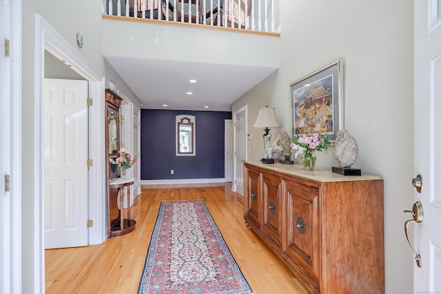 10 Harmony Trl Unit 10, New Milford, CT 06776 - entryway with light wood-style flooring, a high ceiling, and recessed lighting