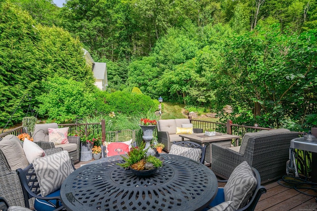 10 Harmony Trl Unit 10, New Milford, CT 06776 - wooden terrace featuring an outdoor living space, outdoor dining area, and a wooded view