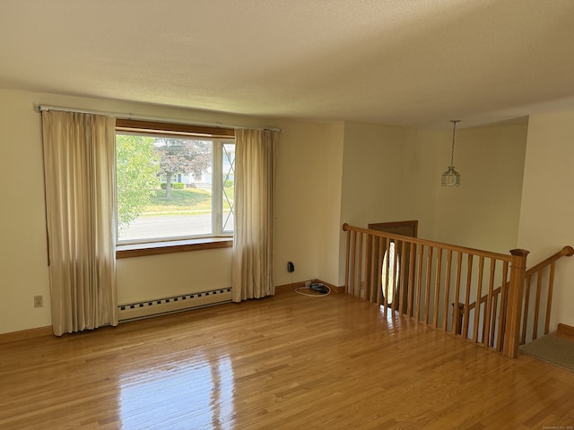 109 Ashley Rd, Bristol, CT 06010 - unfurnished room featuring baseboard heating and wood finished floors
