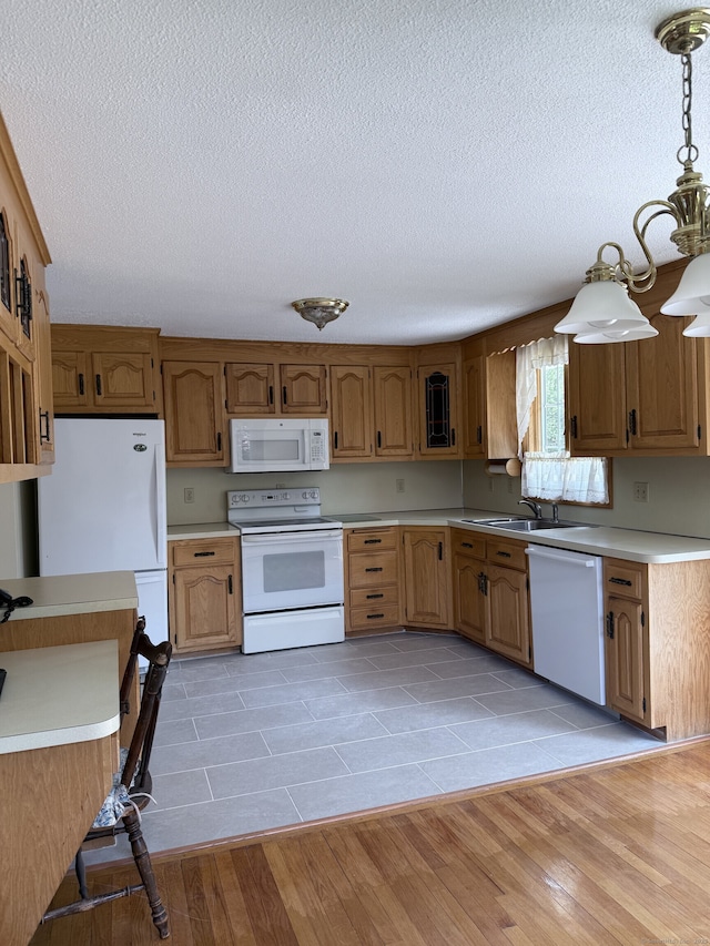 109 Ashley Rd, Bristol, CT 06010 - kitchen with white appliances, light countertops, a textured ceiling, decorative light fixtures, and light tile patterned floors
