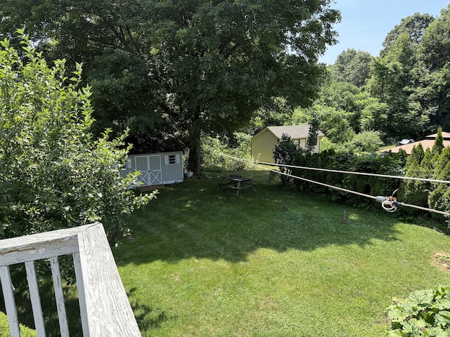 109 Ashley Rd, Bristol, CT 06010 - view of green lawn featuring a storage unit