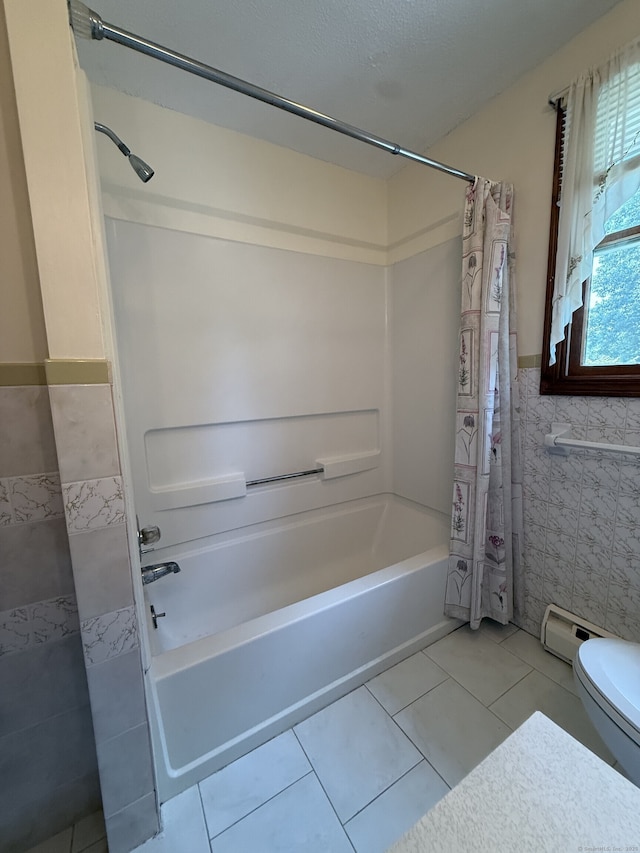 109 Ashley Rd, Bristol, CT 06010 - bathroom with shower / bathtub combination with curtain, tile walls, tile patterned floors, wainscoting, and a baseboard radiator