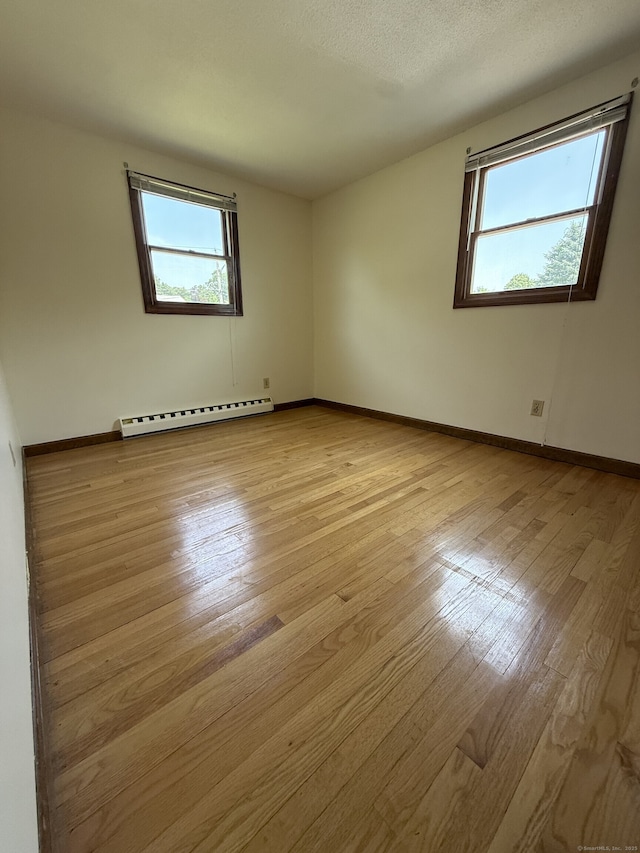 109 Ashley Rd, Bristol, CT 06010 - unfurnished room featuring a baseboard radiator and light wood-style flooring