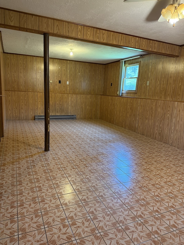 109 Ashley Rd, Bristol, CT 06010 - basement with a textured ceiling, wooden walls, a baseboard radiator, and a ceiling fan