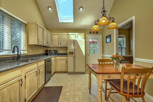 11 Parlor Rock Rd, Trumbull, CT 06611 - kitchen featuring appliances with stainless steel finishes, vaulted ceiling, a skylight, hanging light fixtures, and dark stone countertops