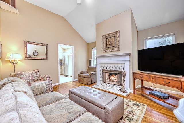 11 Parlor Rock Rd, Trumbull, CT 06611 - living room featuring plenty of natural light, a fireplace, wood finished floors, and vaulted ceiling