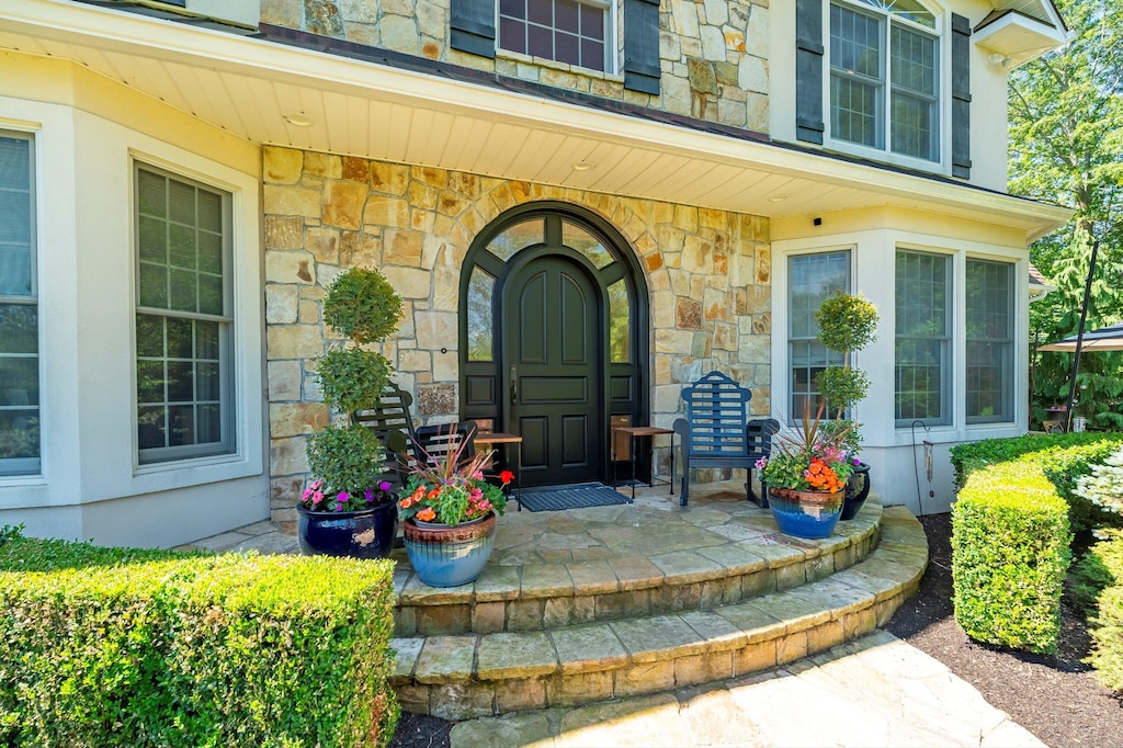 99 Carriage Ln, Roxbury, CT 06783 - doorway to property featuring stone siding