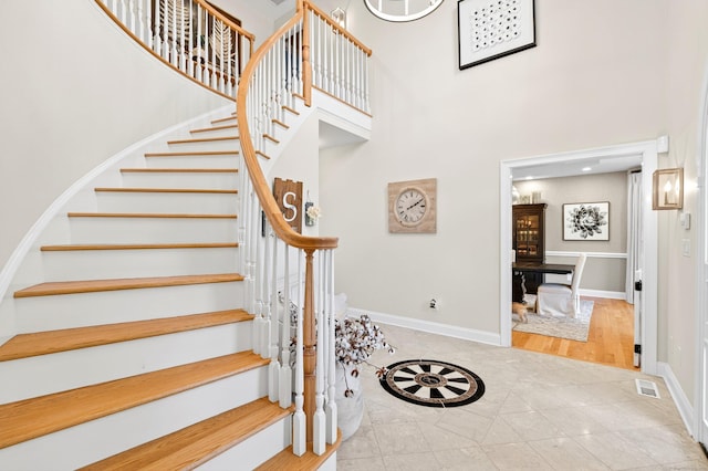 99 Carriage Ln, Roxbury, CT 06783 - stairs featuring a towering ceiling and tile patterned flooring