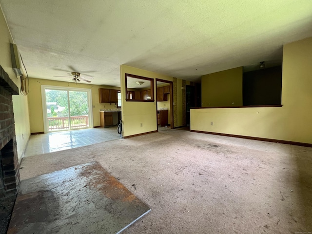 67 Harold Rd, Farmington, CT 06032 - unfurnished living room featuring a fireplace, a textured ceiling, and a ceiling fan