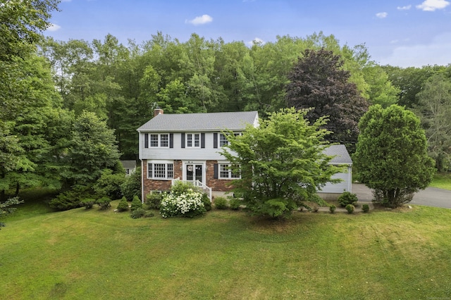 2 Judith Dr, Danbury, CT 06811 - colonial house with a front lawn, a chimney, brick siding, and a wooded view