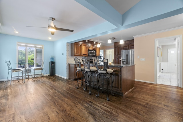 2 Judith Dr, Danbury, CT 06811 - kitchen featuring stainless steel appliances, a ceiling fan, dark wood finished floors, a peninsula, and a breakfast bar area