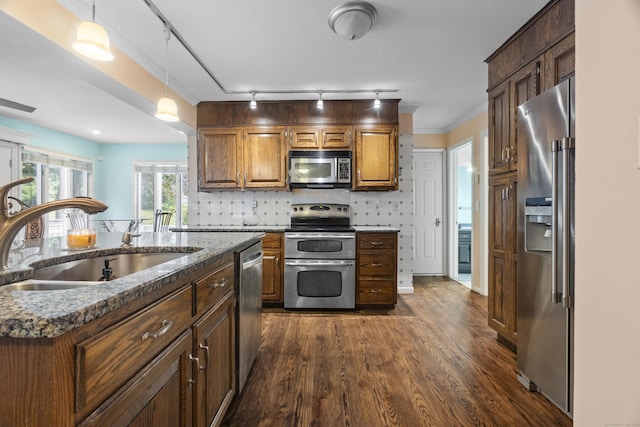 2 Judith Dr, Danbury, CT 06811 - kitchen featuring stainless steel appliances, track lighting, dark wood-style floors, hanging light fixtures, and dark stone countertops
