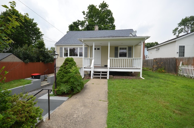 51 Grandview Ave, Norwalk, CT 06850 - bungalow-style home with a porch, a shingled roof, and a chimney