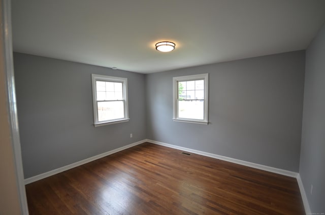 51 Grandview Ave, Norwalk, CT 06850 - empty room with dark wood-style floors and baseboards