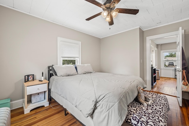 33 Hugh St, West Hartford, CT 06119 - bedroom with light wood finished floors, crown molding, and ceiling fan