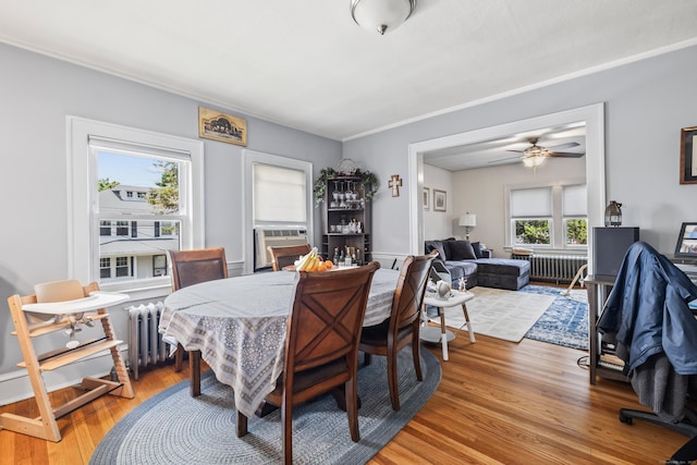 33 Hugh St, West Hartford, CT 06119 - dining area with radiator, light wood-style flooring, a ceiling fan, and cooling unit