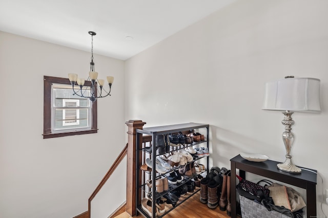 33 Hugh St, West Hartford, CT 06119 - staircase featuring a chandelier and wood finished floors