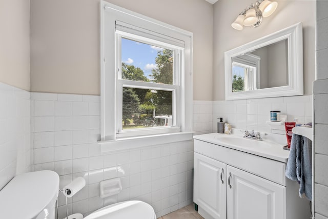 33 Hugh St, West Hartford, CT 06119 - half bath with tile walls, vanity, a wainscoted wall, and tile patterned floors