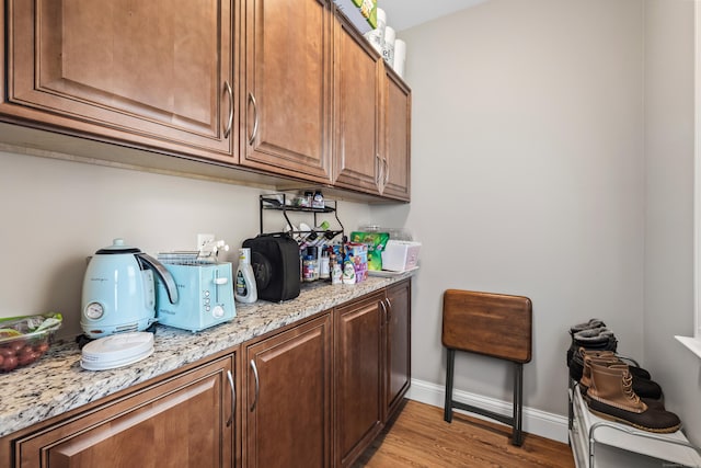 33 Hugh St, West Hartford, CT 06119 - bar featuring light wood-type flooring and baseboards
