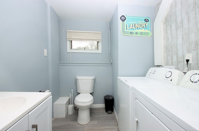 1357 Meriden Ave, Southington, CT 06489 - bathroom with washer and dryer, vanity, and wood finished floors