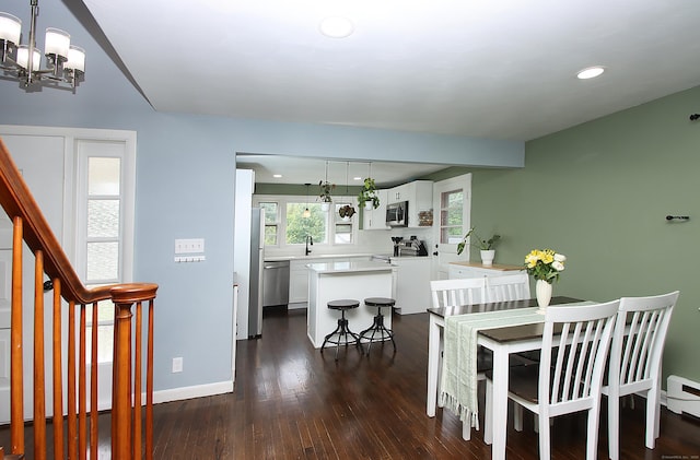 1357 Meriden Ave, Southington, CT 06489 - dining space featuring a chandelier, dark wood-type flooring, recessed lighting, and stairs