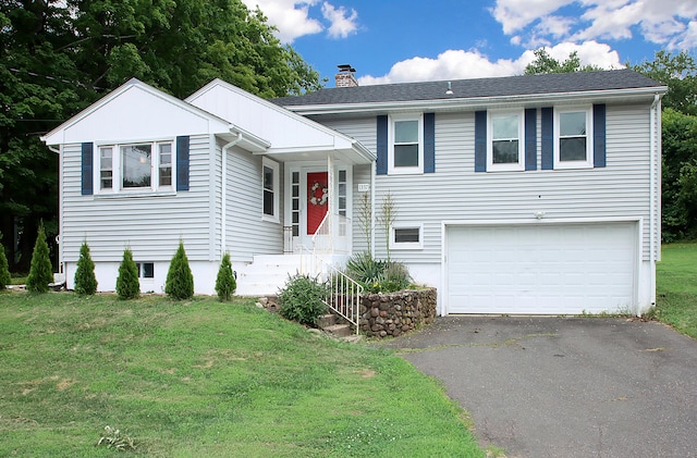 1357 Meriden Ave, Southington, CT 06489 - tri-level home with driveway, a garage, a chimney, and a front lawn