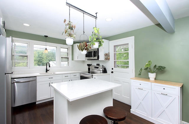 1357 Meriden Ave, Southington, CT 06489 - kitchen featuring stainless steel appliances, dark wood finished floors, white cabinetry, recessed lighting, and decorative backsplash