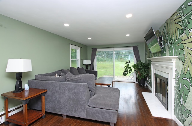 1357 Meriden Ave, Southington, CT 06489 - living room with wood finished floors, a fireplace with flush hearth, and recessed lighting